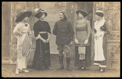 Download the full-sized image of Prisoners of war performing a play at a prisoner of war camp in Cottbus. Photographic postcard, 191-.