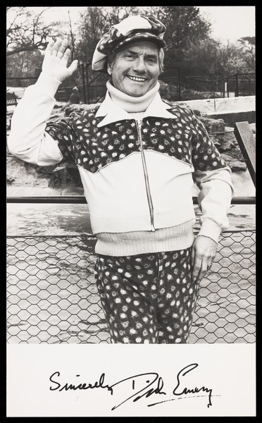 Download the full-sized image of Dick Emery waving in a park. Photograph, 197-.