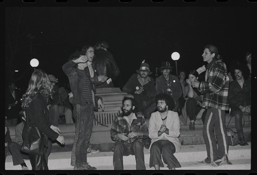 Download the full-sized image of Sylvia Rivera Stands Listening with Group of Protestors at Weinstein Hall Demonstration